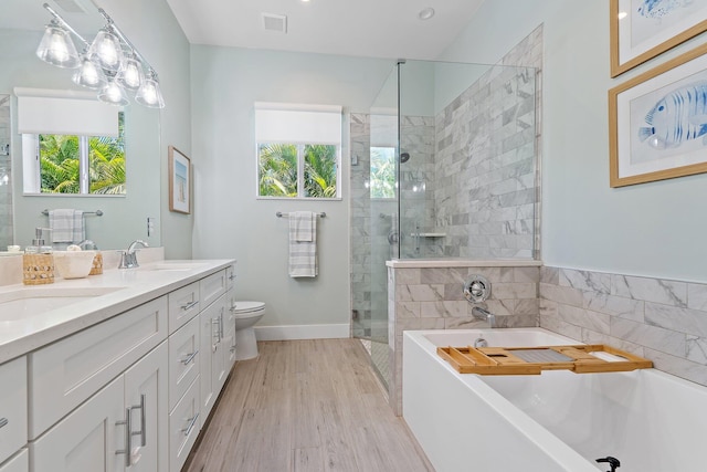 17742 Evangeline Ave, Jupiter, FL 33458 - bathroom with plenty of natural light, a garden tub, double vanity, and a stall shower