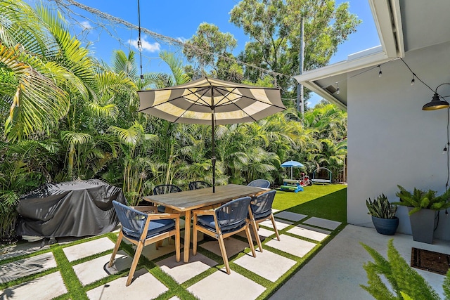 17742 Evangeline Ave, Jupiter, FL 33458 - view of patio with outdoor dining space and area for grilling
