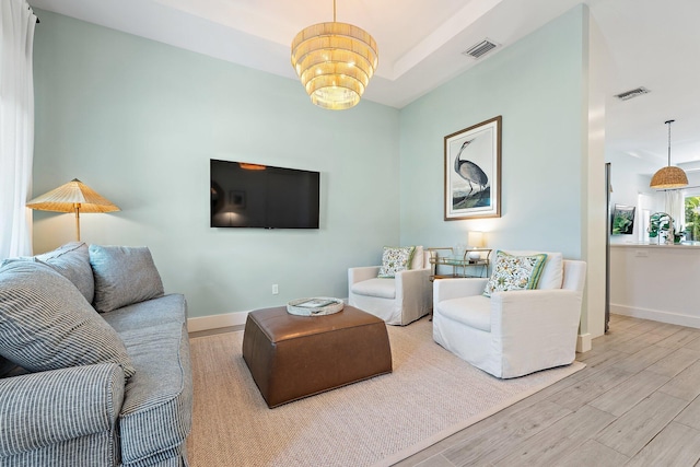 17742 Evangeline Ave, Jupiter, FL 33458 - living area featuring wood finished floors and a chandelier
