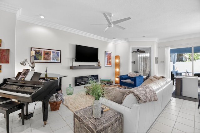 2002 Valencia Dr, Delray Beach, FL 33445 - living area with ceiling fan, light tile patterned floors, crown molding, and a glass covered fireplace