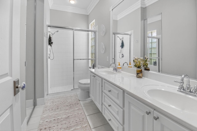 2002 Valencia Dr, Delray Beach, FL 33445 - bathroom featuring a shower stall, double vanity, crown molding, and tile patterned flooring