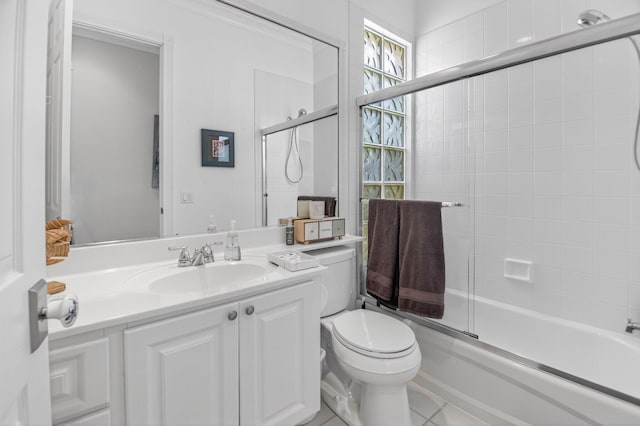 2002 Valencia Dr, Delray Beach, FL 33445 - full bathroom featuring vanity, shower / bath combination with glass door, and tile patterned floors
