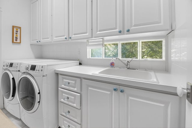 2002 Valencia Dr, Delray Beach, FL 33445 - laundry room featuring cabinet space and independent washer and dryer