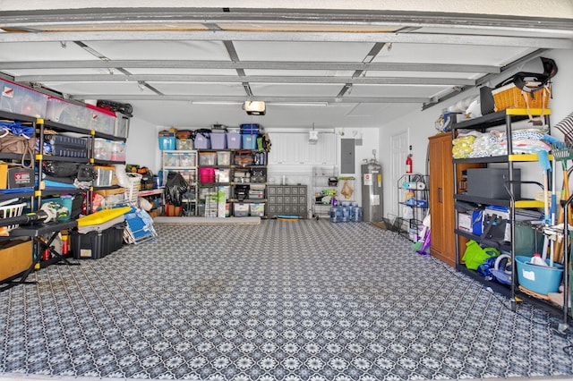 2002 Valencia Dr, Delray Beach, FL 33445 - garage with electric water heater, electric panel, and a garage door opener