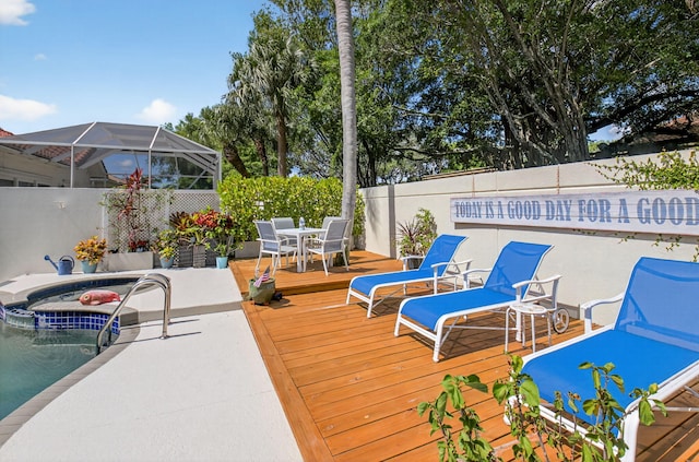 2002 Valencia Dr, Delray Beach, FL 33445 - wooden terrace featuring outdoor dining space, a fenced backyard, and a hot tub