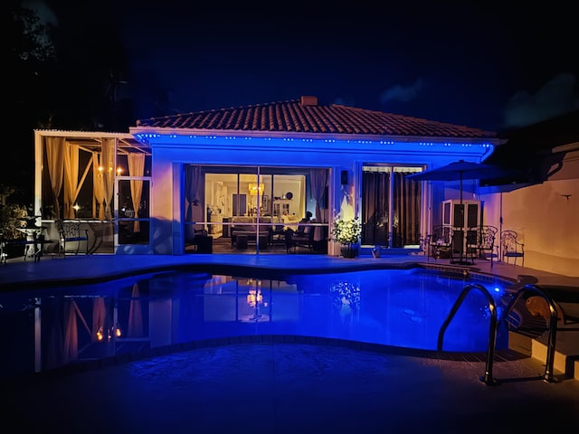 2002 Valencia Dr, Delray Beach, FL 33445 - pool at twilight with an outdoor pool