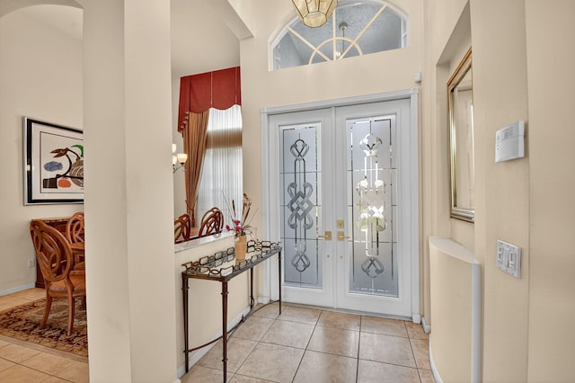 11291 Barca Blvd, Boynton Beach, FL 33437 - entrance foyer featuring tile patterned flooring, french doors, a high ceiling, and a chandelier