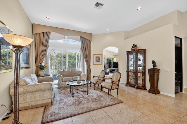 11291 Barca Blvd, Boynton Beach, FL 33437 - living area featuring light tile patterned floors, arched walkways, recessed lighting, and a towering ceiling