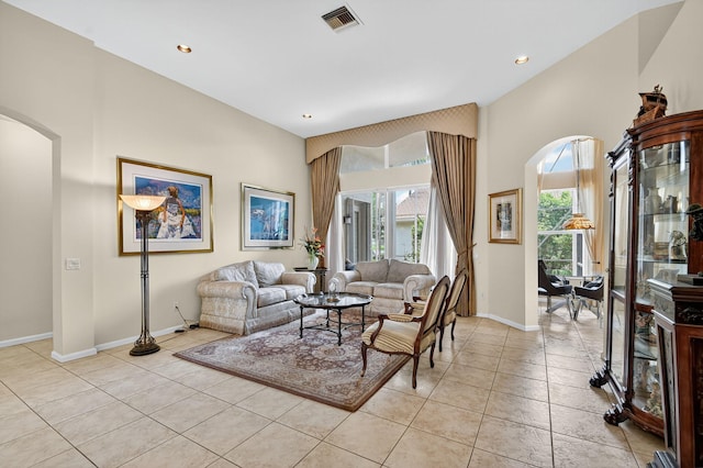 11291 Barca Blvd, Boynton Beach, FL 33437 - living room with arched walkways, light tile patterned flooring, and recessed lighting