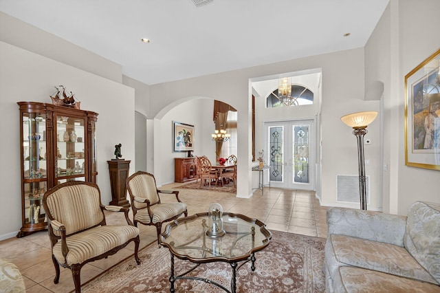11291 Barca Blvd, Boynton Beach, FL 33437 - living room featuring arched walkways, a chandelier, light tile patterned floors, and recessed lighting