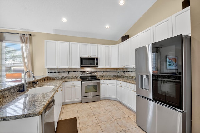 11291 Barca Blvd, Boynton Beach, FL 33437 - kitchen with stainless steel appliances, light tile patterned floors, stone counters, decorative backsplash, and white cabinets