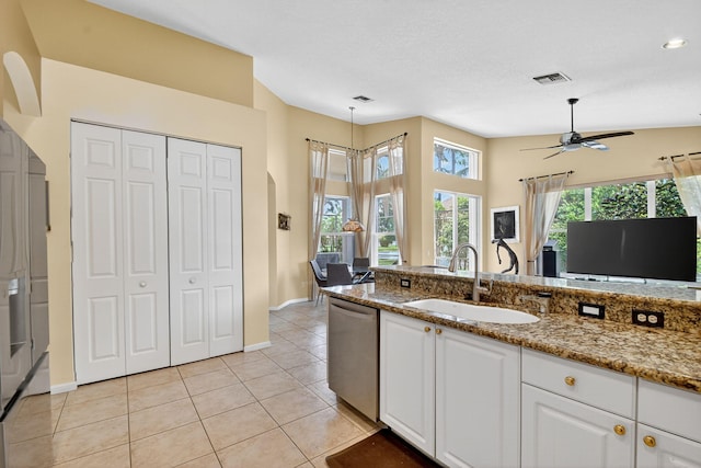 11291 Barca Blvd, Boynton Beach, FL 33437 - kitchen with dishwasher, white cabinets, light tile patterned flooring, light stone countertops, and a ceiling fan