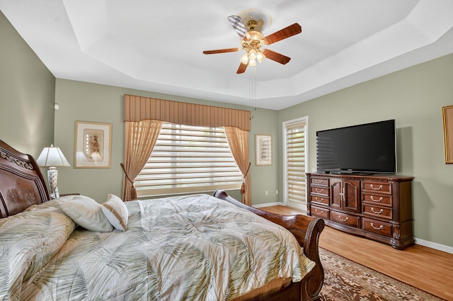 11291 Barca Blvd, Boynton Beach, FL 33437 - bedroom with a raised ceiling, wood finished floors, and ceiling fan