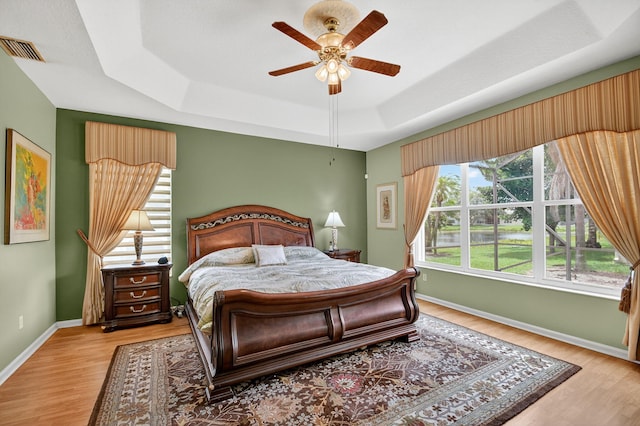 11291 Barca Blvd, Boynton Beach, FL 33437 - bedroom featuring a raised ceiling, wood finished floors, and a ceiling fan