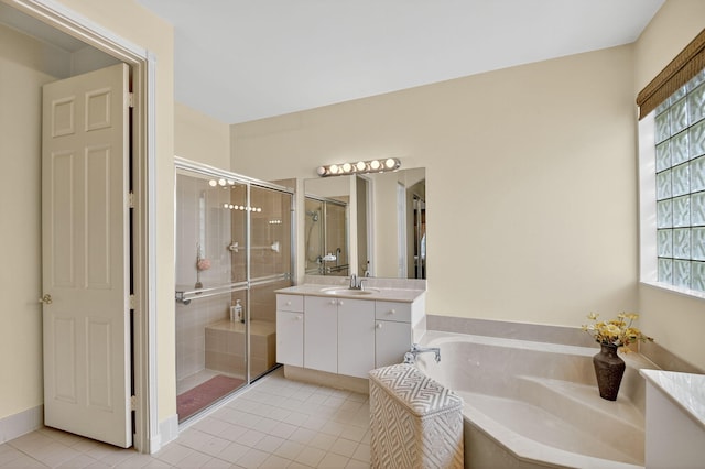 11291 Barca Blvd, Boynton Beach, FL 33437 - bathroom featuring tile patterned floors, a garden tub, vanity, and a shower stall