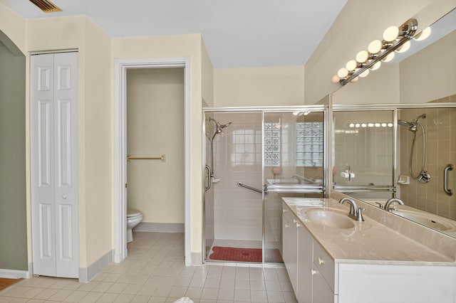11291 Barca Blvd, Boynton Beach, FL 33437 - bathroom featuring a closet, vanity, tile patterned floors, and a stall shower