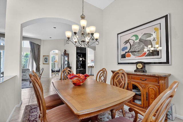 11291 Barca Blvd, Boynton Beach, FL 33437 - dining space featuring arched walkways and a chandelier