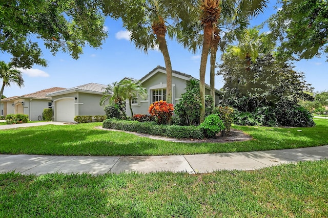 11291 Barca Blvd, Boynton Beach, FL 33437 - view of front of property featuring stucco siding, a garage, and a front lawn