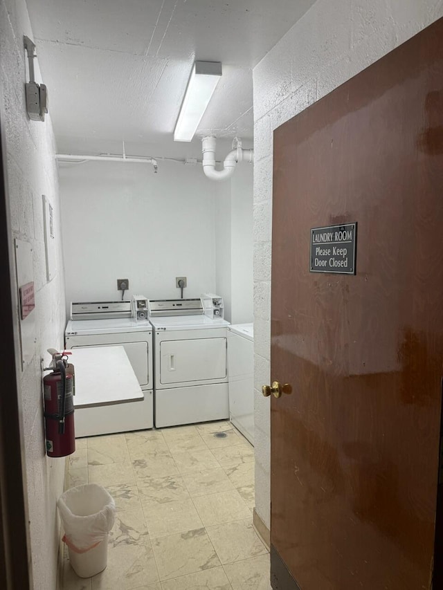 671 NE 195th St Unit 316E, Miami, FL 33179 - laundry area featuring independent washer and dryer and light floors
