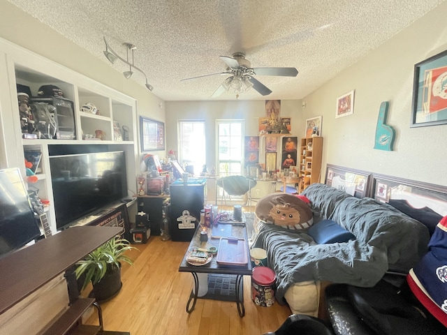 1186 Camprock Rd, West Palm Beach, FL 33417 - living area featuring a textured ceiling, ceiling fan, and wood finished floors