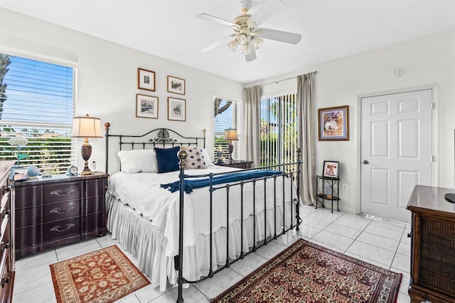 12480 Crystal Pointe Dr Unit 102, Boynton Beach, FL 33437 - bedroom featuring light tile patterned floors, ceiling fan, and access to exterior