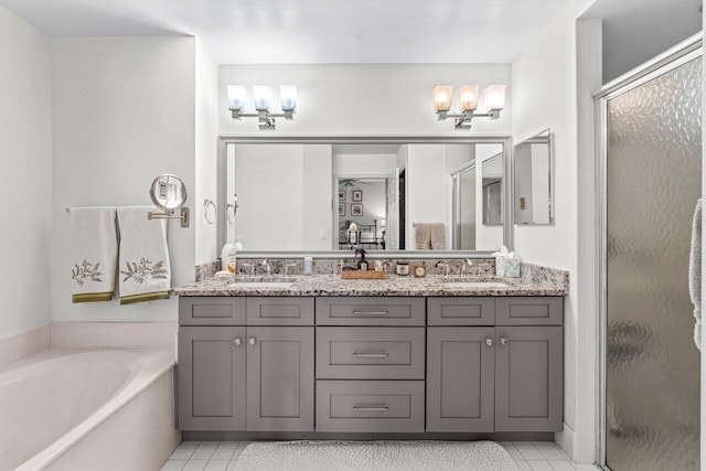 12480 Crystal Pointe Dr Unit 102, Boynton Beach, FL 33437 - bathroom featuring tile patterned flooring, a stall shower, double vanity, and a garden tub