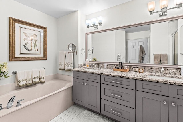 12480 Crystal Pointe Dr Unit 102, Boynton Beach, FL 33437 - full bathroom with double vanity, a bath, a stall shower, and tile patterned floors