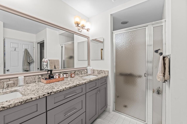 12480 Crystal Pointe Dr Unit 102, Boynton Beach, FL 33437 - bathroom featuring a shower stall, double vanity, and tile patterned floors