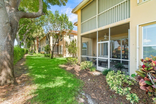 12480 Crystal Pointe Dr Unit 102, Boynton Beach, FL 33437 - view of grassy yard featuring a sunroom