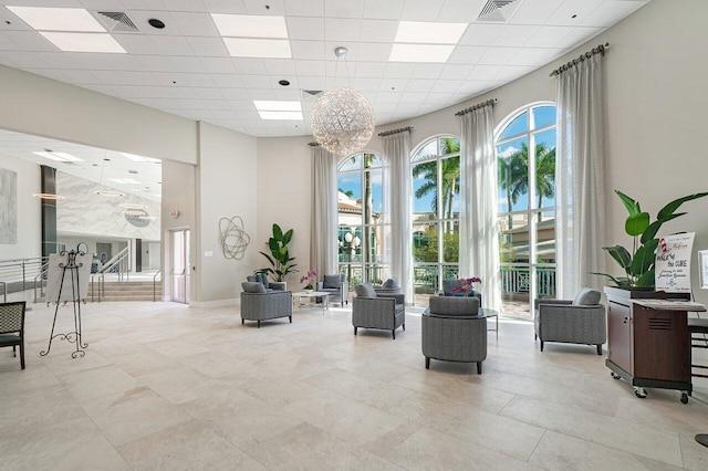 12480 Crystal Pointe Dr Unit 102, Boynton Beach, FL 33437 - building lobby featuring a high ceiling and a paneled ceiling