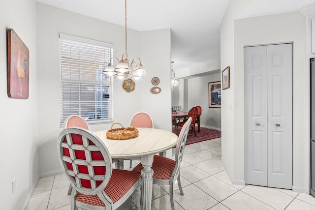 12480 Crystal Pointe Dr Unit 102, Boynton Beach, FL 33437 - dining room featuring a chandelier and baseboards