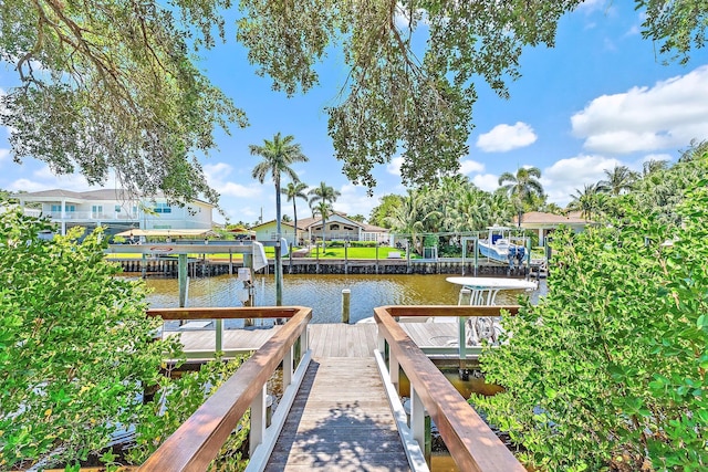2438 Inland Cove Rd, Palm Beach Gardens, FL 33410 - dock with a water view, a residential view, and boat lift