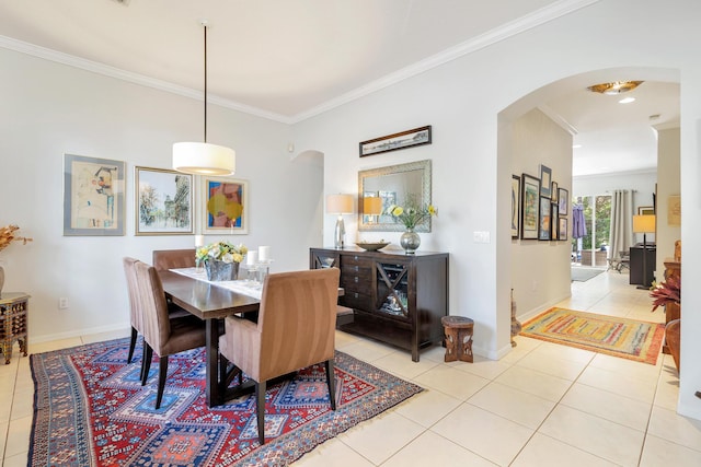 63 Lake Eden Dr, Boynton Beach, FL 33435 - dining area with arched walkways, crown molding, and tile patterned floors