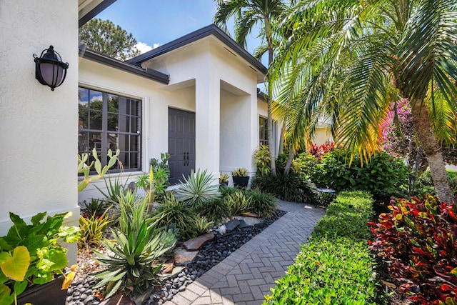 63 Lake Eden Dr, Boynton Beach, FL 33435 - view of side of property with stucco siding
