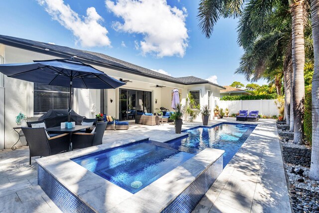 63 Lake Eden Dr, Boynton Beach, FL 33435 - view of swimming pool featuring outdoor lounge area, a ceiling fan, and a fenced backyard
