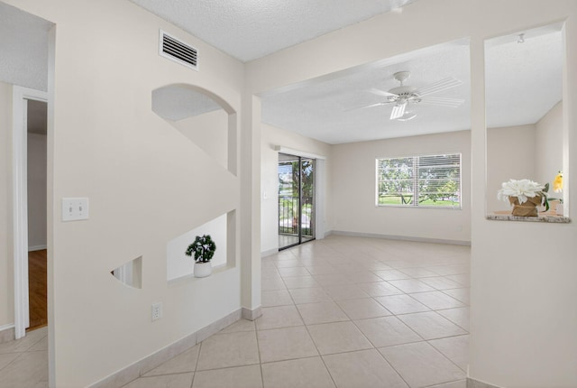 9521 Boca Cove Cir Unit 508, Boca Raton, FL 33428 - unfurnished room with a textured ceiling, light tile patterned floors, and ceiling fan