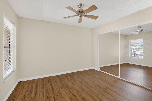 9521 Boca Cove Cir Unit 508, Boca Raton, FL 33428 - unfurnished bedroom with wood finished floors, a closet, and ceiling fan