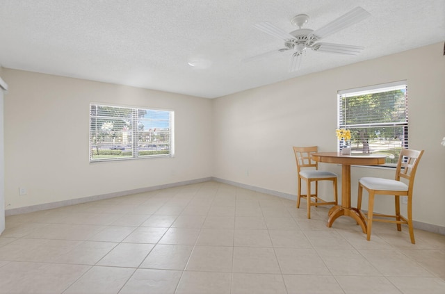 9521 Boca Cove Cir Unit 508, Boca Raton, FL 33428 - unfurnished dining area with plenty of natural light, a textured ceiling, and ceiling fan