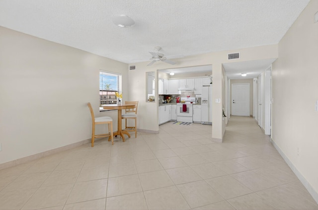 9521 Boca Cove Cir Unit 508, Boca Raton, FL 33428 - living room featuring a textured ceiling, a ceiling fan, and light tile patterned floors