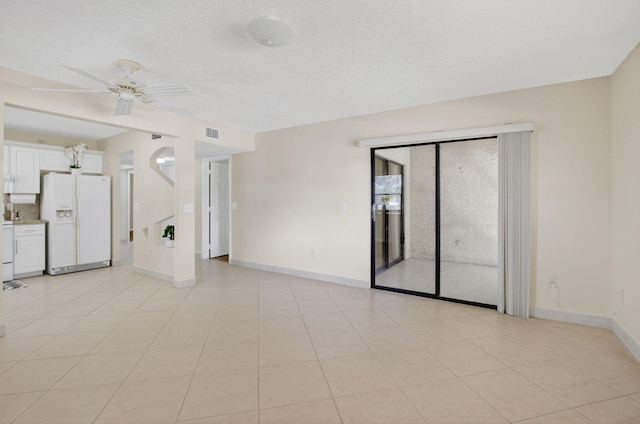 9521 Boca Cove Cir Unit 508, Boca Raton, FL 33428 - unfurnished room featuring a ceiling fan and a textured ceiling