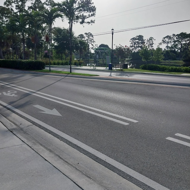 2482 SE Floresta Dr, Port Saint Lucie, FL 34984 - view of asphalt street featuring sidewalks