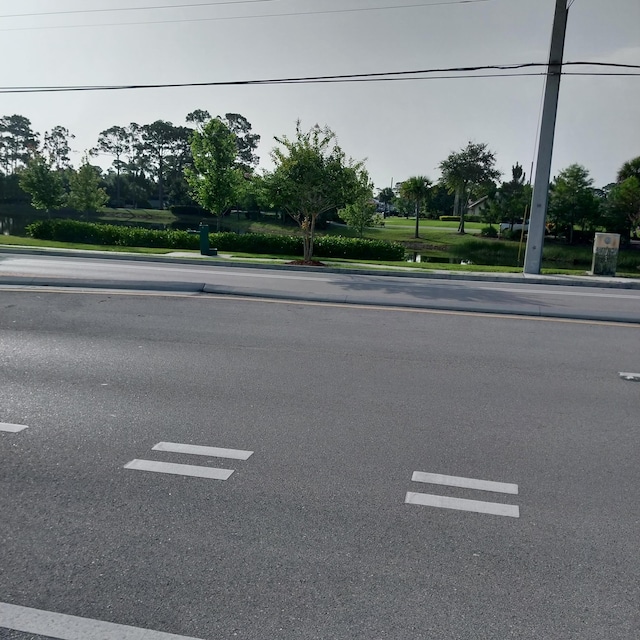 2482 SE Floresta Dr, Port Saint Lucie, FL 34984 - view of asphalt road with curbs