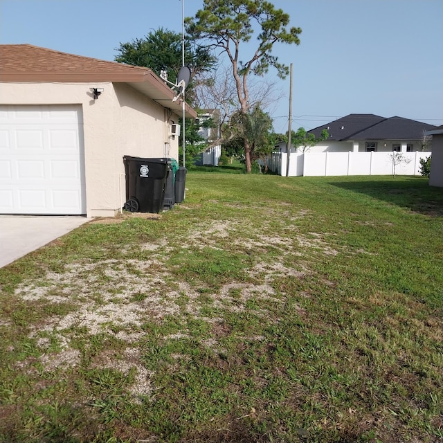 2482 SE Floresta Dr, Port Saint Lucie, FL 34984 - view of yard featuring an attached garage