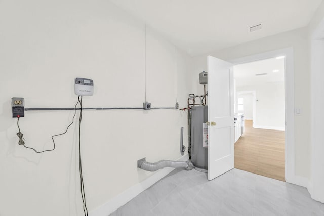 400 Riverside Dr, Palm Beach Gardens, FL 33410 - basement featuring water heater and baseboards