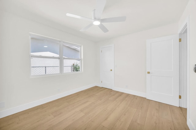 400 Riverside Dr, Palm Beach Gardens, FL 33410 - unfurnished bedroom featuring light wood-style flooring and a ceiling fan