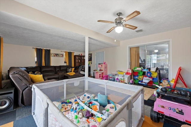 6015 Raintree Trl, Fort Pierce, FL 34982 - playroom with carpet, a textured ceiling, and ceiling fan