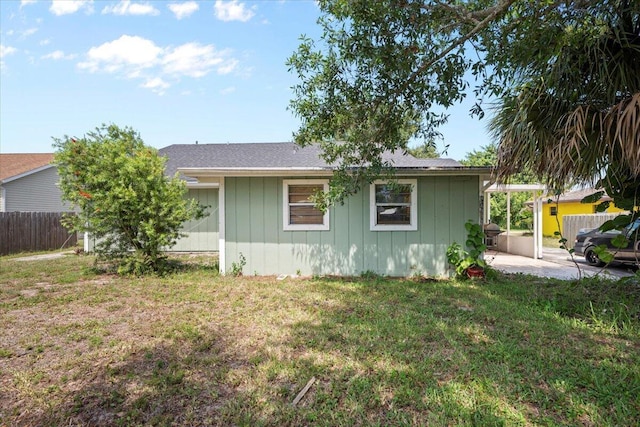 6015 Raintree Trl, Fort Pierce, FL 34982 - view of side of home with a patio area and board and batten siding