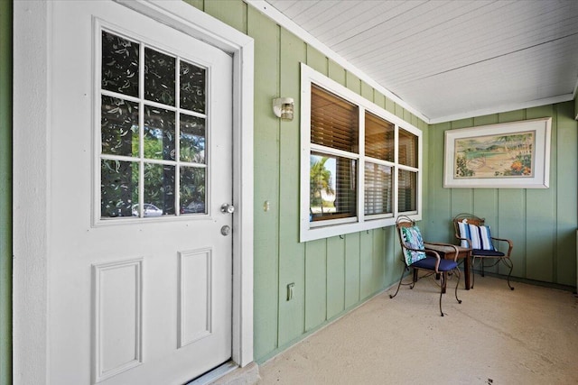 6015 Raintree Trl, Fort Pierce, FL 34982 - doorway to property featuring a porch and board and batten siding