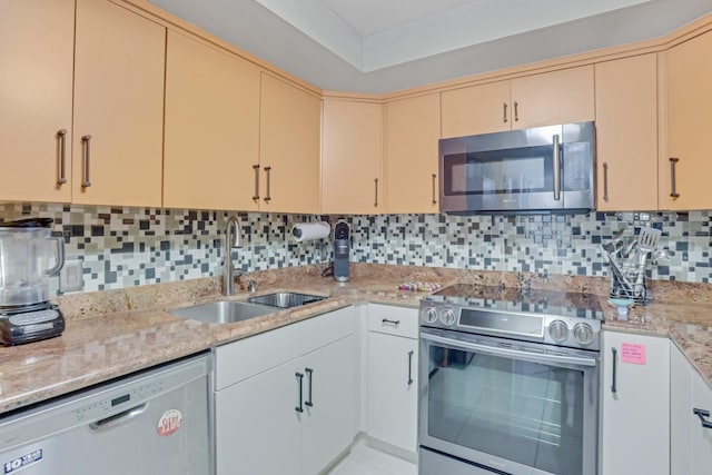 4101 N Ocean Blvd Unit 908, Boca Raton, FL 33431 - kitchen featuring stainless steel appliances, cream cabinetry, and tasteful backsplash