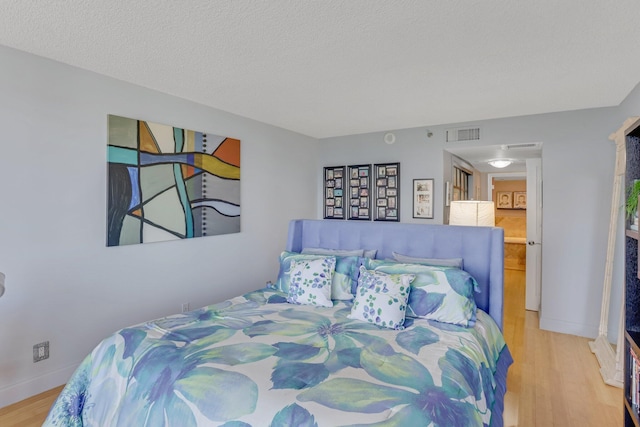 4101 N Ocean Blvd Unit 908, Boca Raton, FL 33431 - bedroom featuring wood finished floors and a textured ceiling